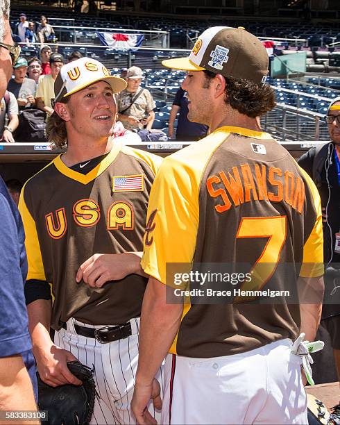 Dansby Swanson of the Atlanta Braves and Team USA talks with Carson Fulmer of the Chicago White Sox and Team USA prior to the SiriusXM All-Star...