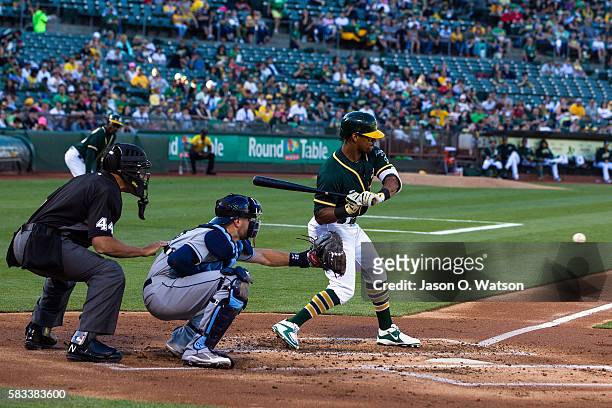 Khris Davis of the Oakland Athletics at bat in front of Curt Casali of the Tampa Bay Rays and umpire Kerwin Danley during the first inning at the...