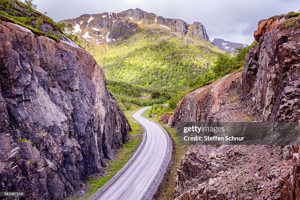 Empty winding road from above - street canyon