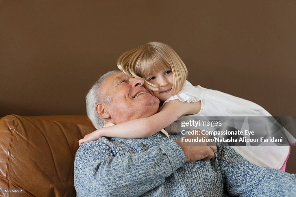 Granddaughter hugging Grandfather