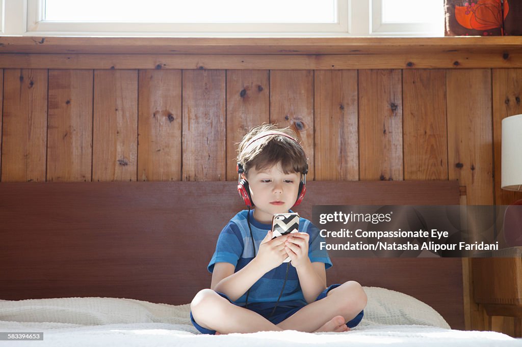 Boy wearing headphones listening to music