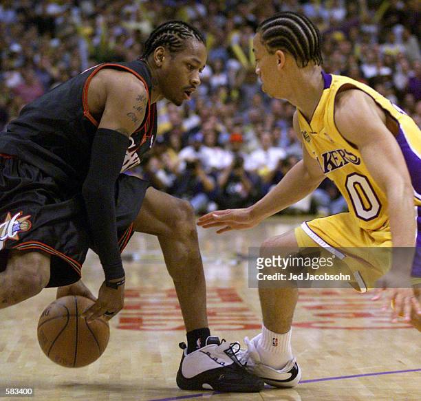 Tyronn Lue of the Los Angeles Lakers guards Allen Iverson of the Philadelphia 76ers during Game 1 of the NBA Finals at Staples Center in Los Angeles,...