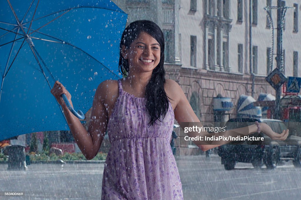 Woman having fun in the rain