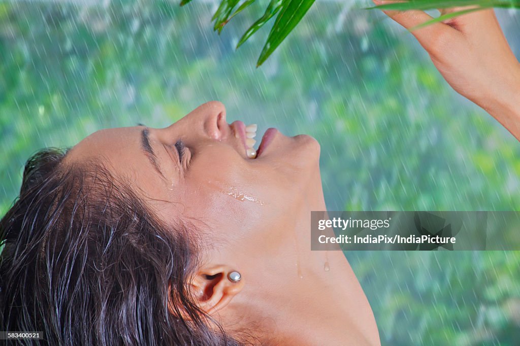 Woman enjoying the rain