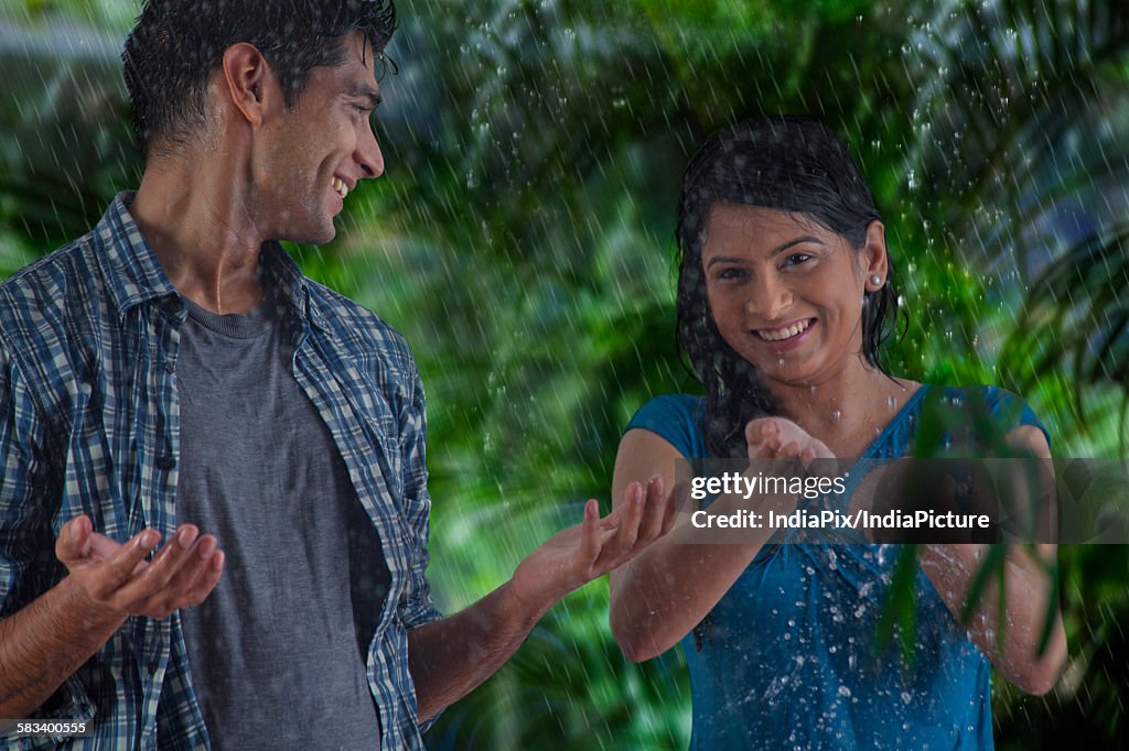 Couple enjoying in the rain