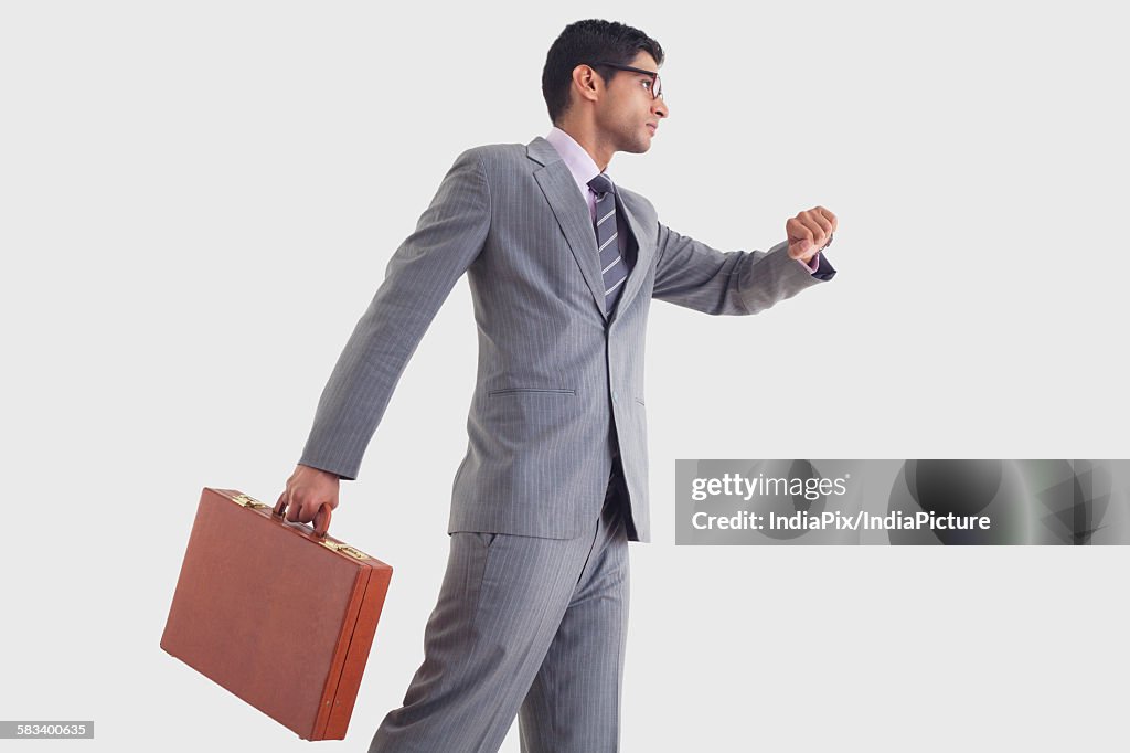 Businessman getting late for work