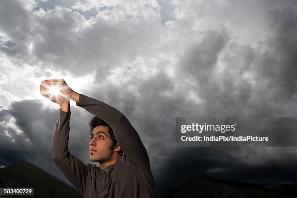 Catch Some Rays 92 Man Catching Sun Rays Stock Photos, High-Res Pictures, and Images ...