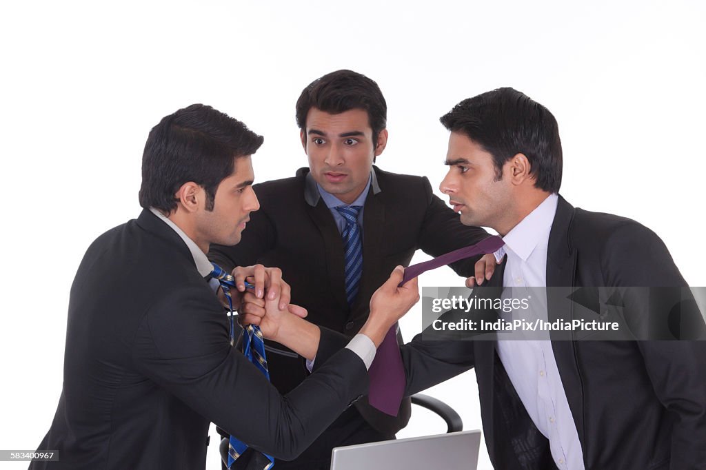 Businessmen getting into a fight