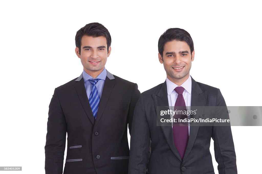 Portrait of two businessmen smiling