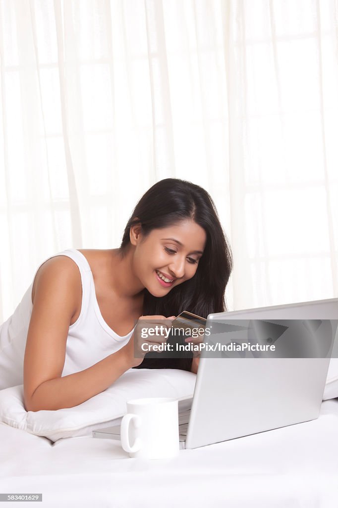 Young WOMEN using credit card