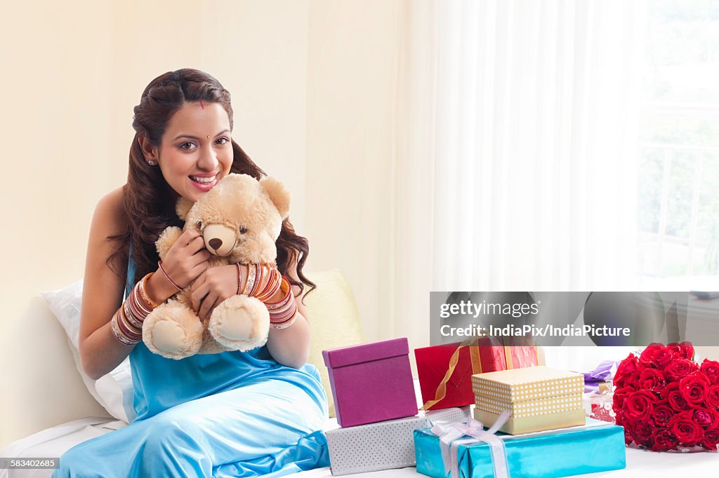 Portrait of woman with teddy bear