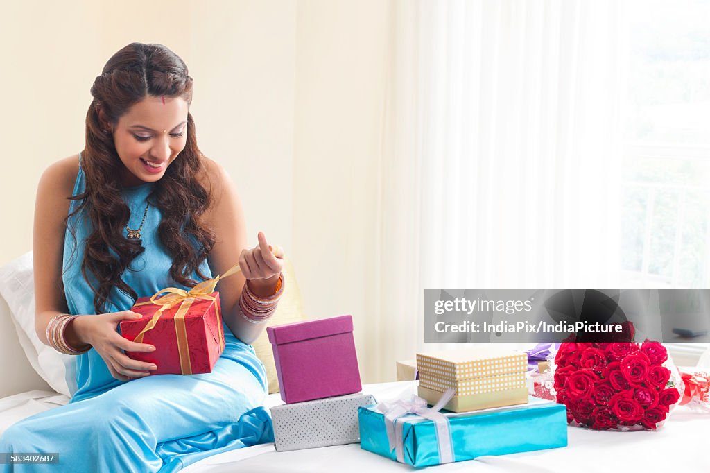 Woman opening a gift box