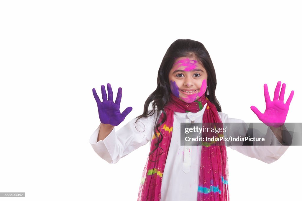 Portrait of a girl with holi colour on her hands
