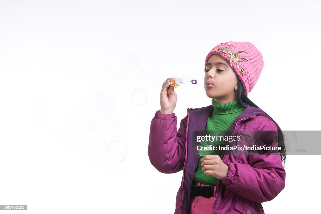 Girl blowing bubbles