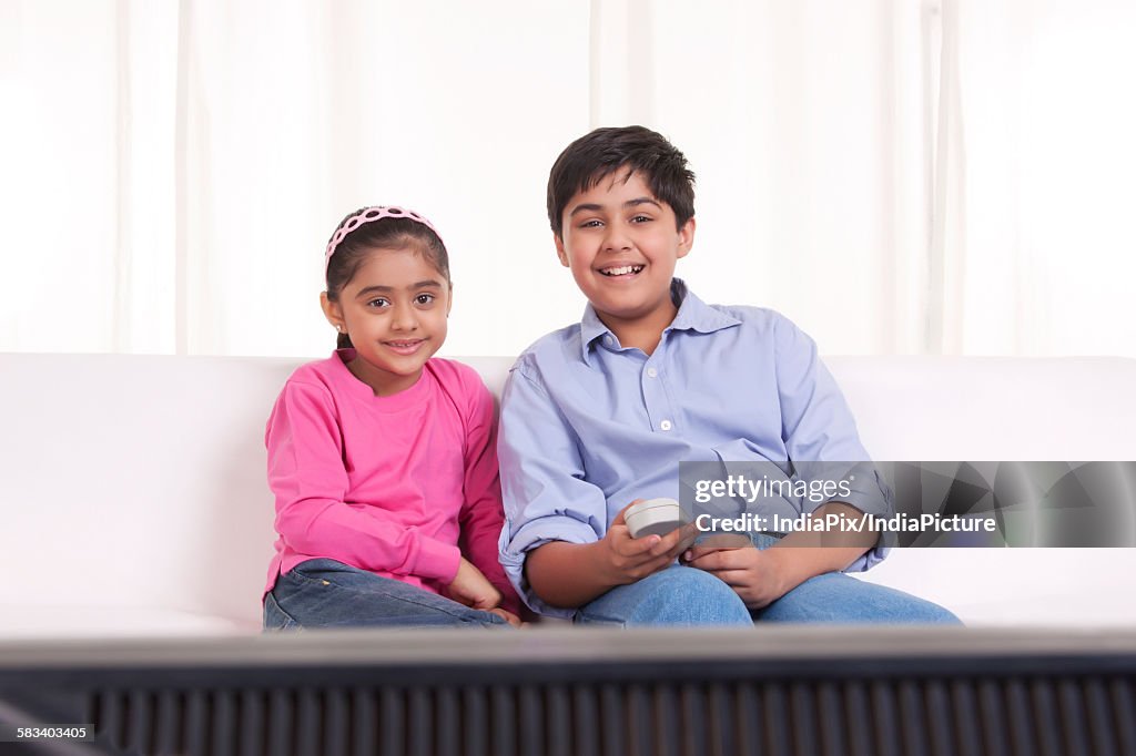 Brother and sister watching tv