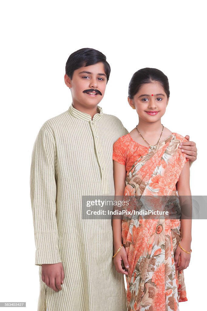 Portrait of kids dressed as husband and wife