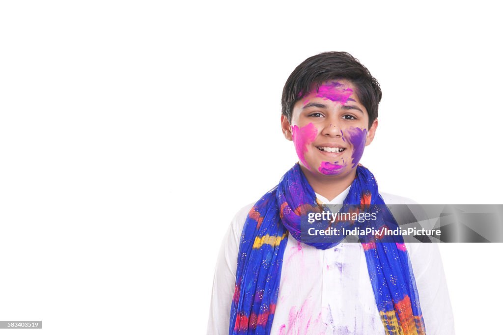 Portrait of a boy with holi colour