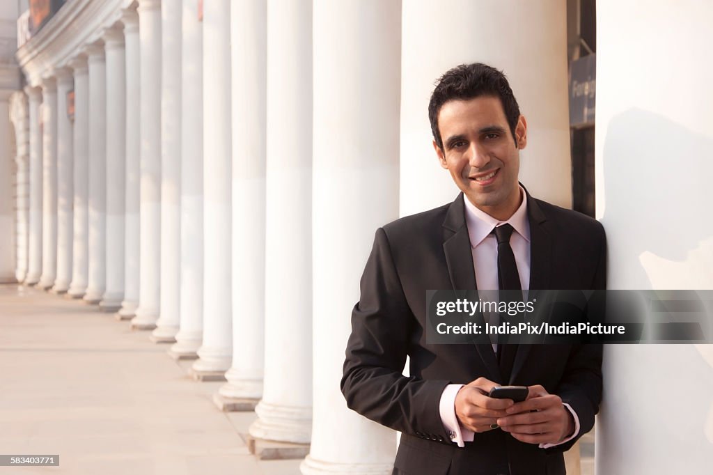 Portrait of a businessman smiling , INDIA , DELHI