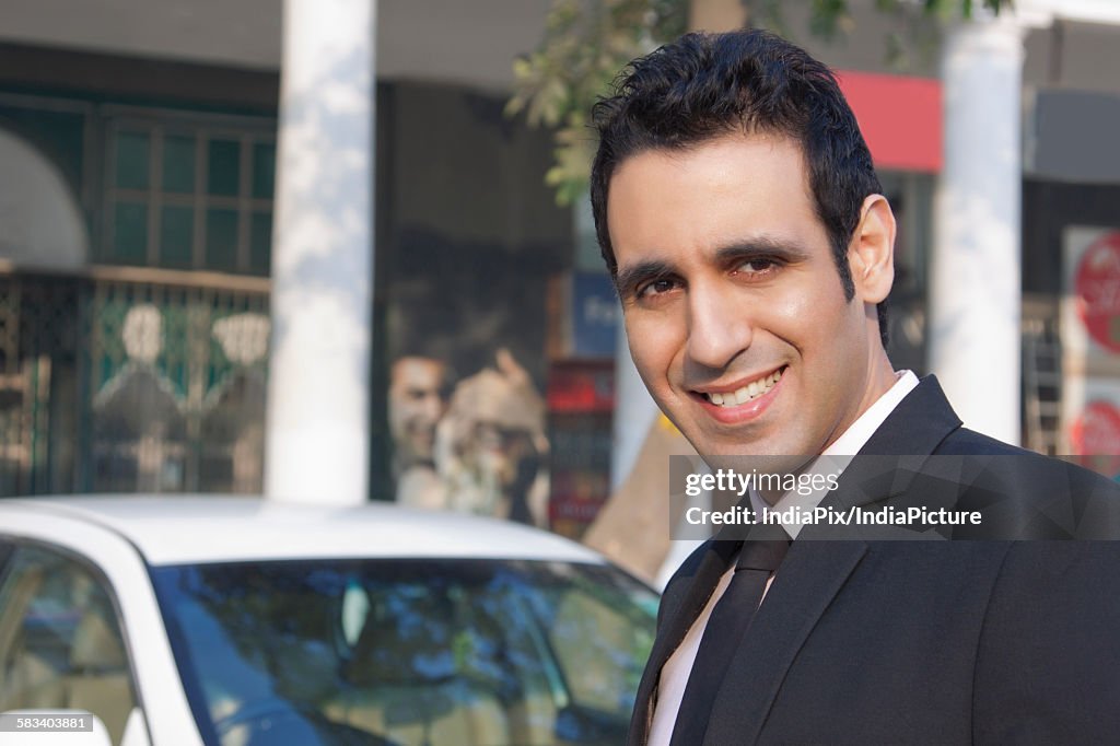 Portrait of a businessman smiling , INDIA , DELHI