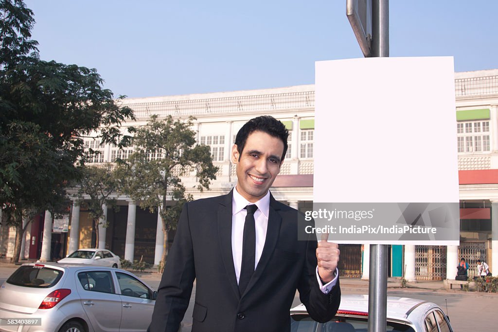 Portrait of a businessman gesturing , INDIA , DELHI