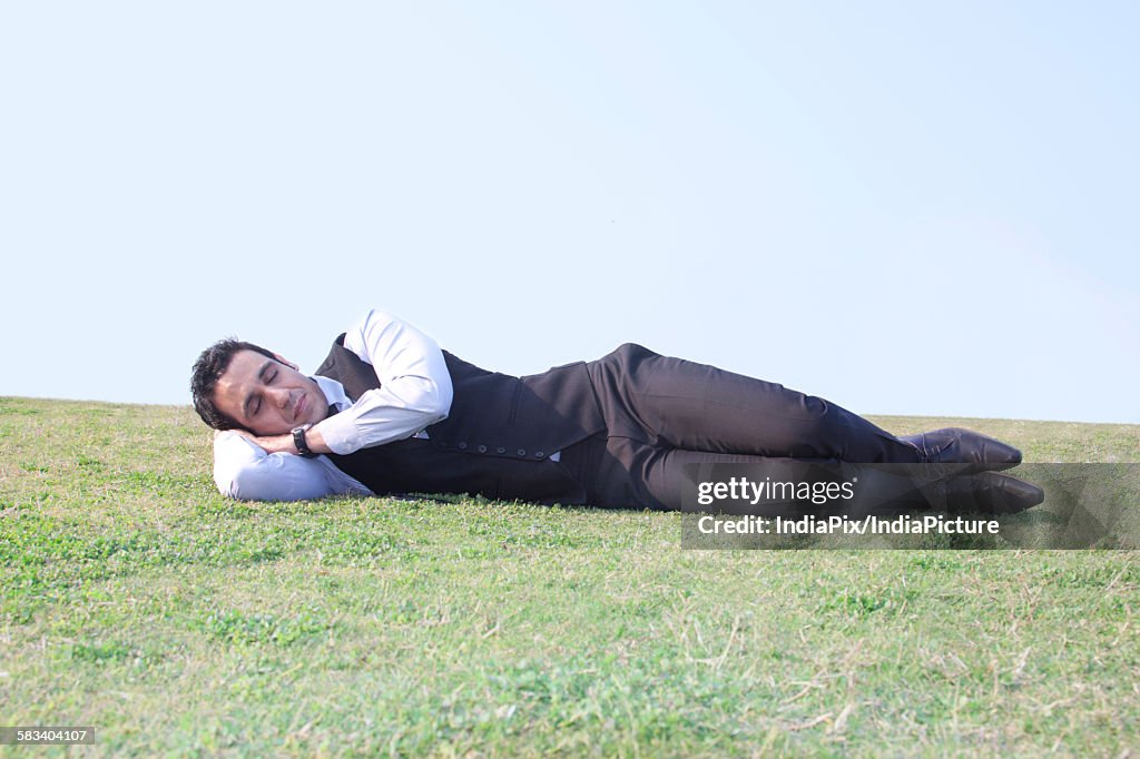 Businessman sleeping , INDIA , DELHI