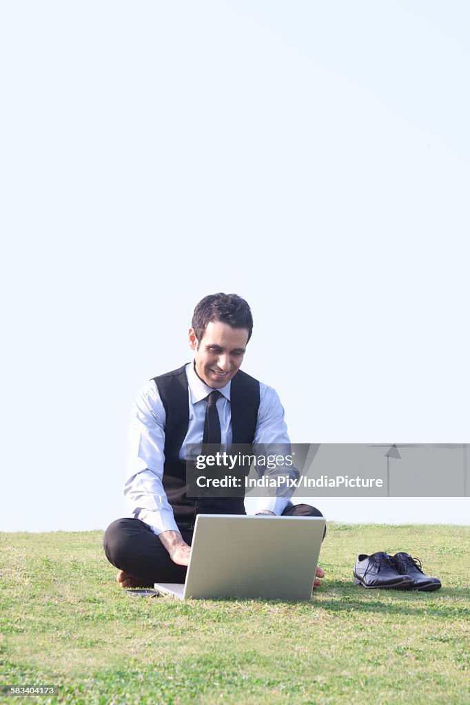 Businessman working on a laptop , INDIA , DELHI