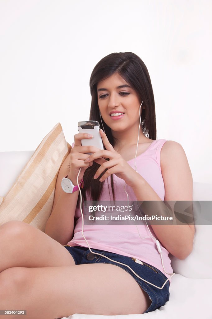 Young woman listening to music