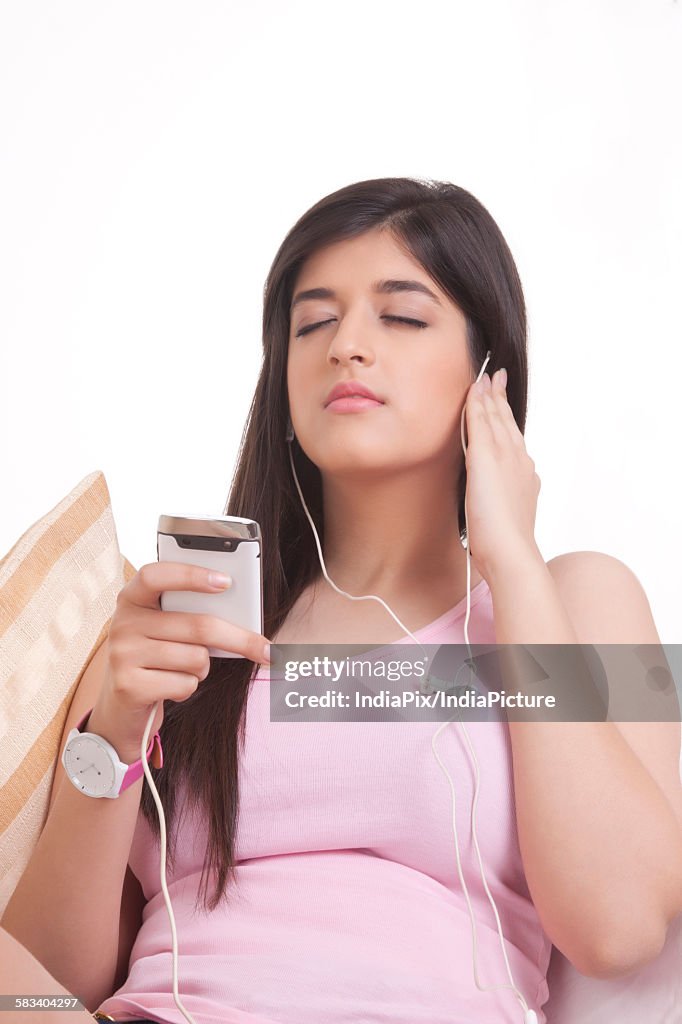 Young woman listening to music