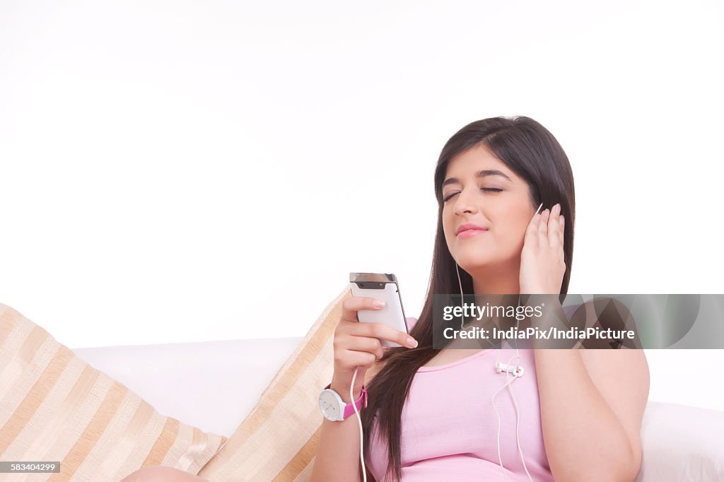 Young woman listening to music