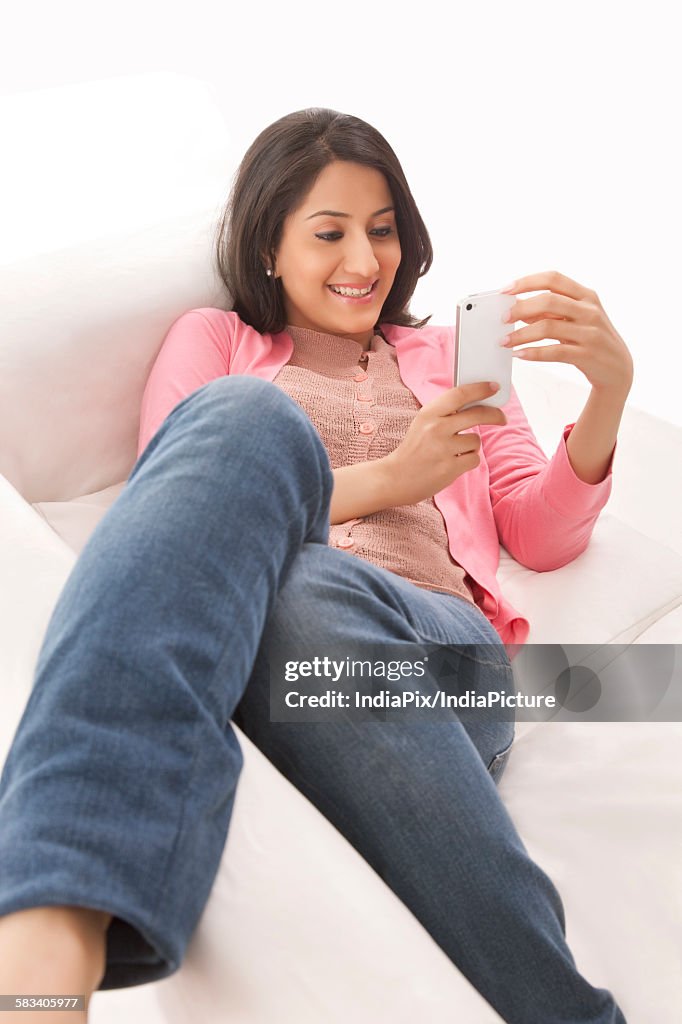 Young woman using her cell phone