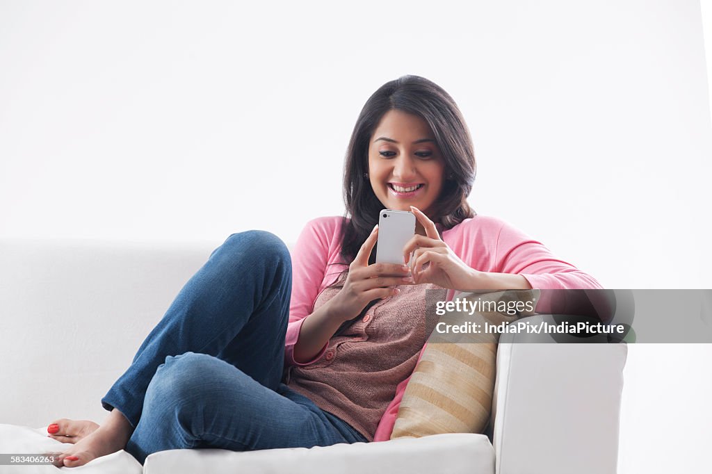 Young woman using her cell phone