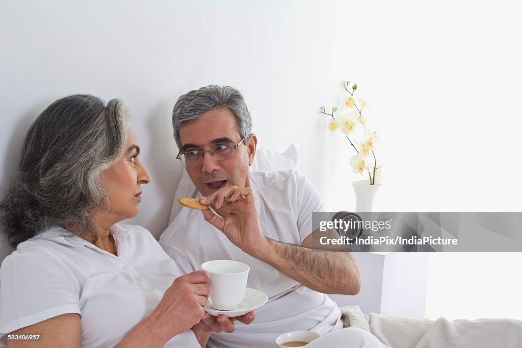 Husband and wife having tea