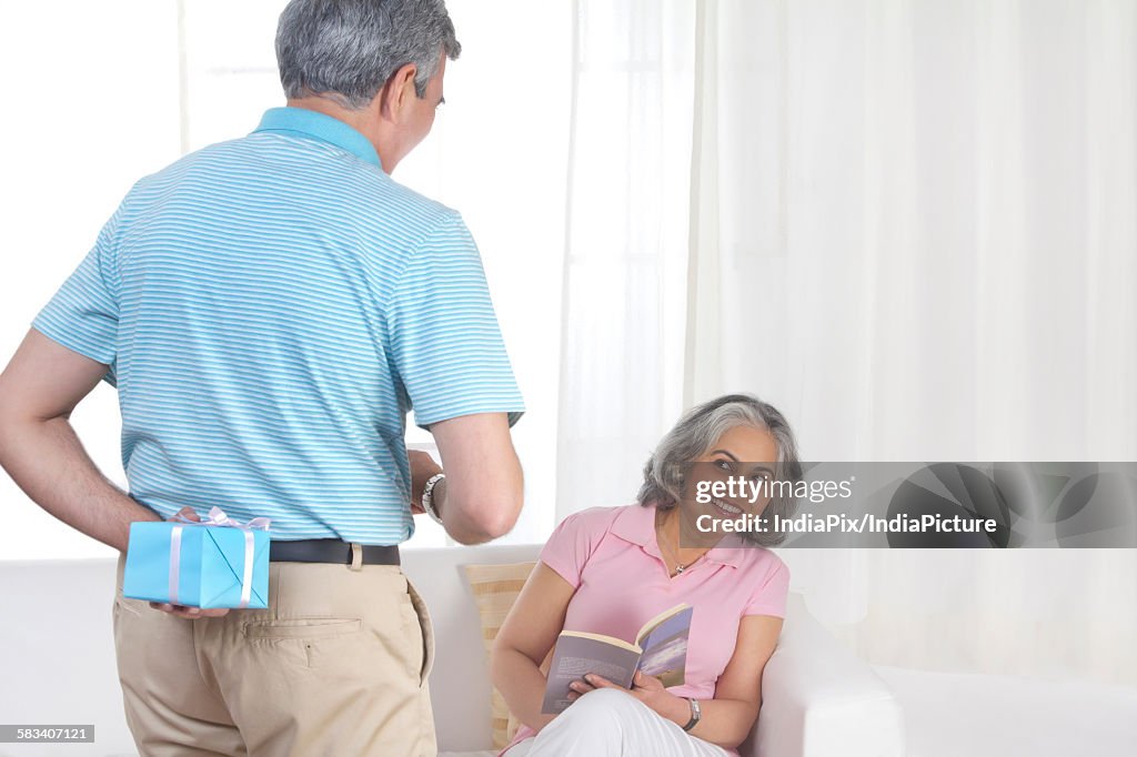 Husband giving a gift to his wife