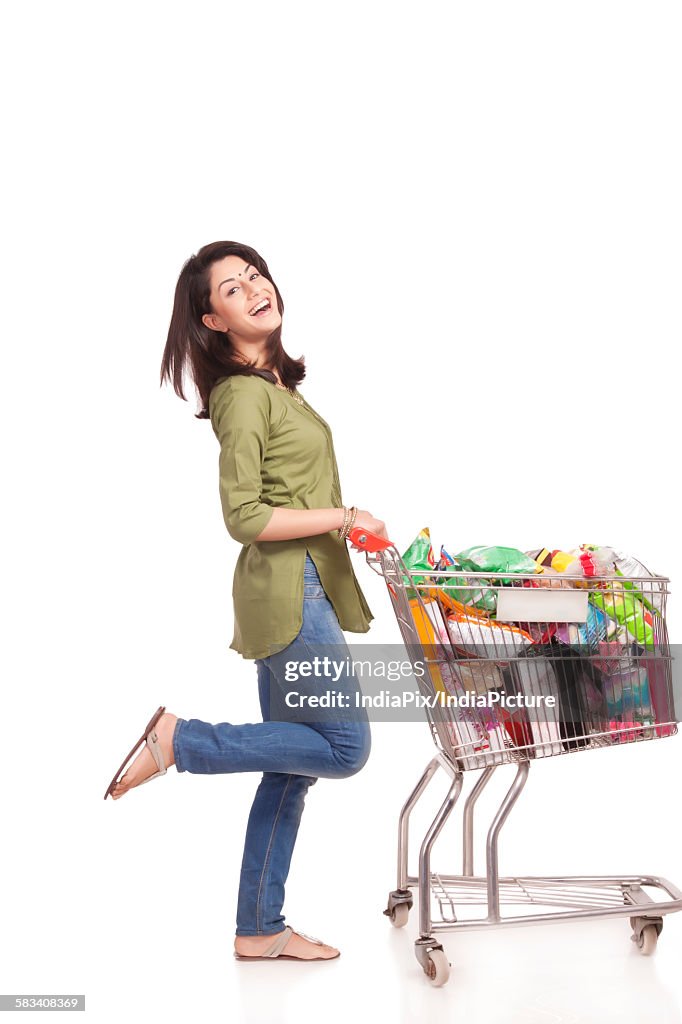 Portrait of a married woman with a shopping cart