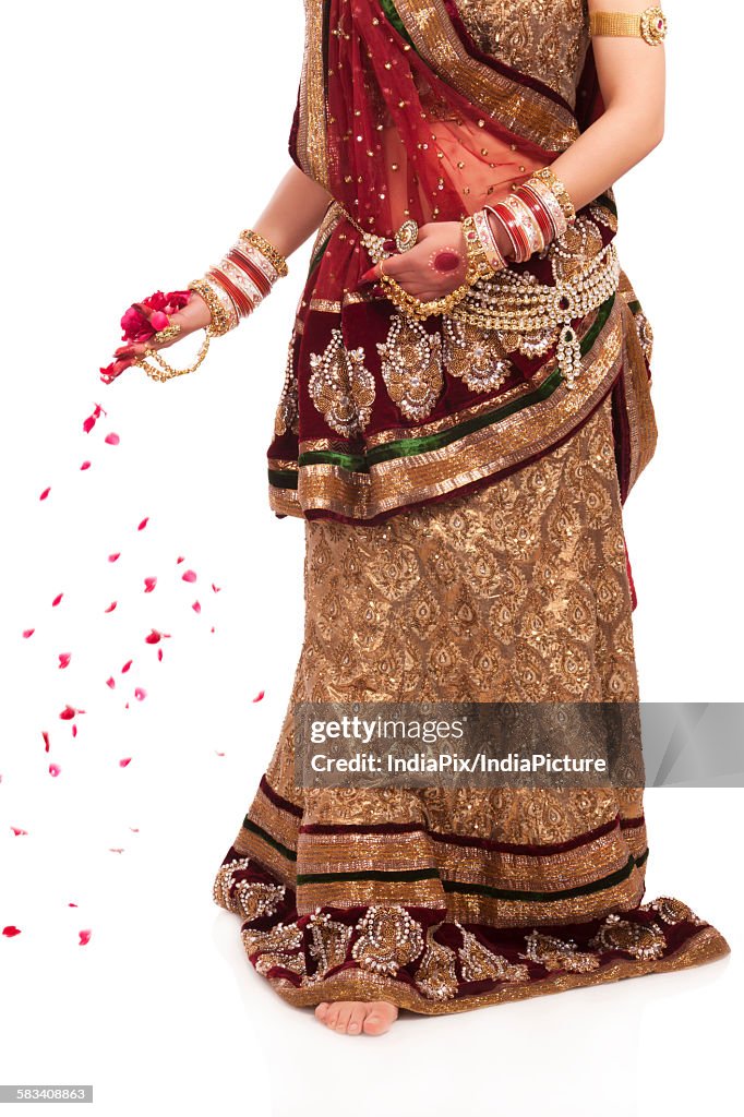 Bride with rose petals in her hand