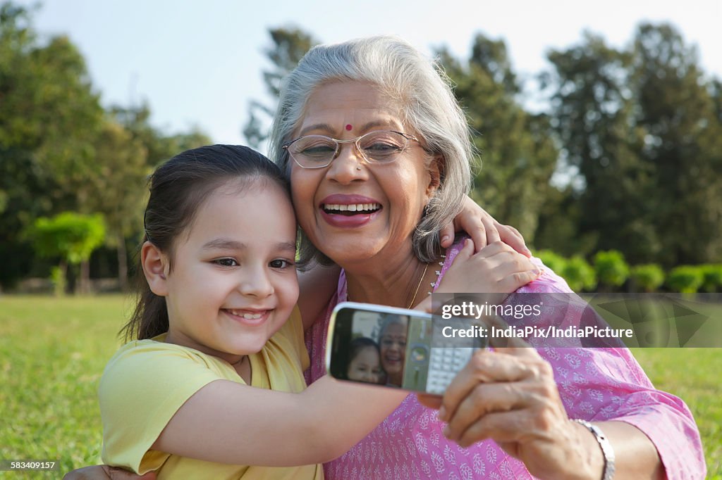 Grandmother and granddaughter taking a self portrait