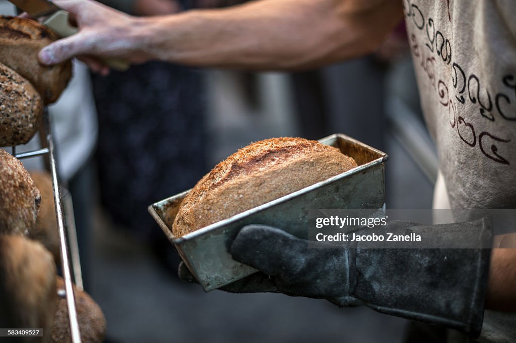 Taking the bread out of the loaf tin