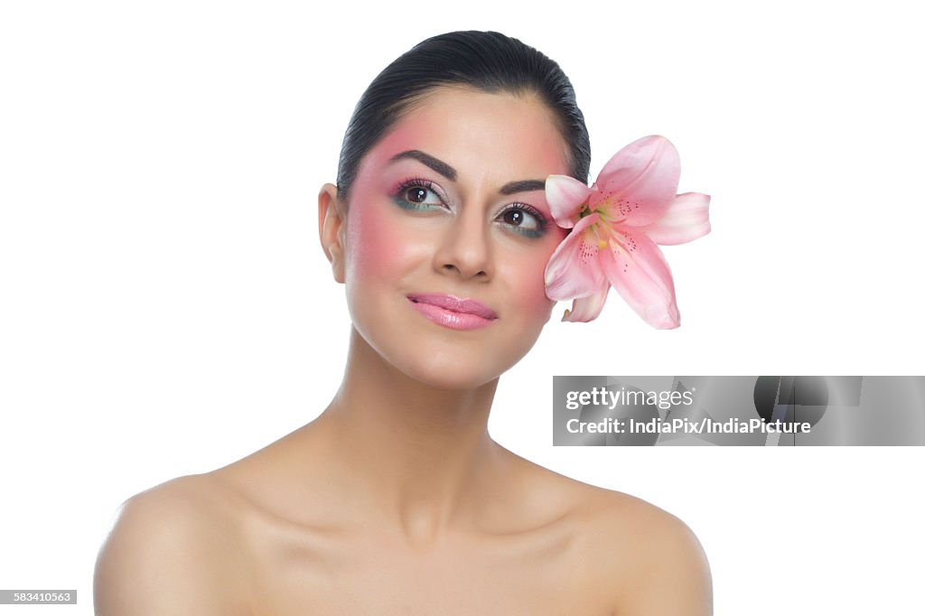 Portrait of a beautiful woman with flower