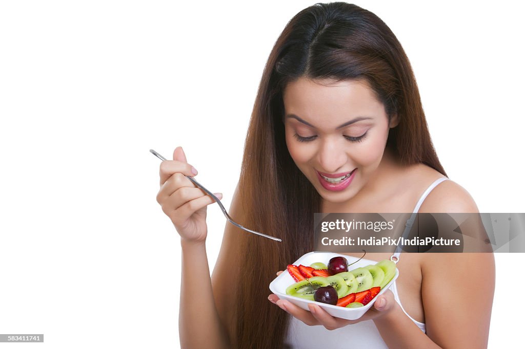 Woman with a bowl of fruits