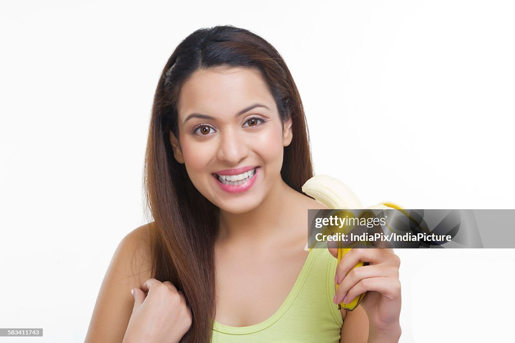 Portrait of woman with a banana