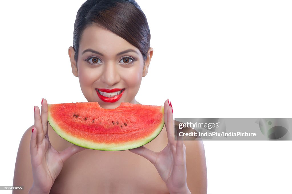 Portrait of a woman with a watermelon