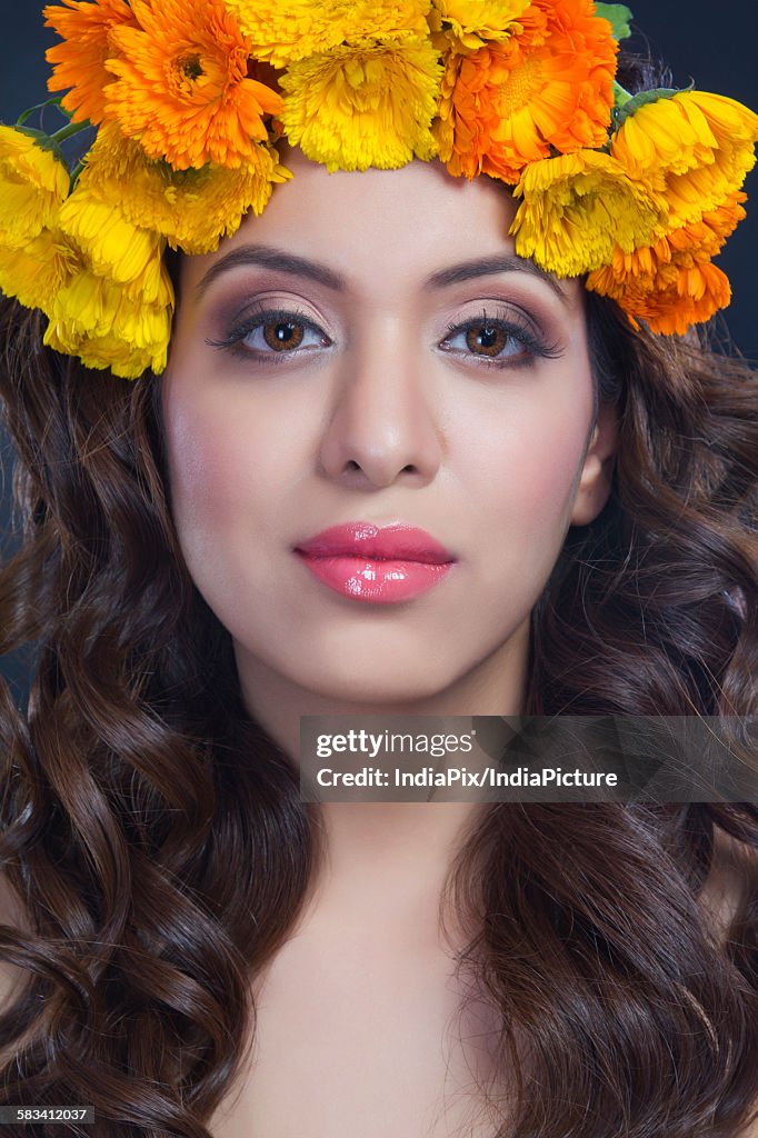 Portrait of a beautiful woman with flowers in her hair