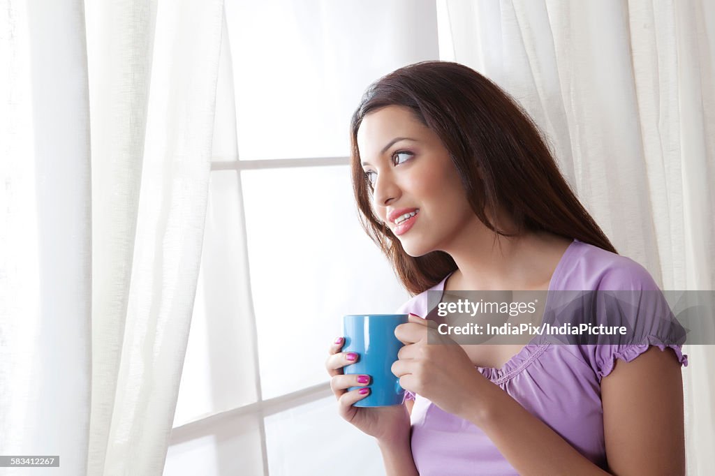 Young woman with a mug of tea