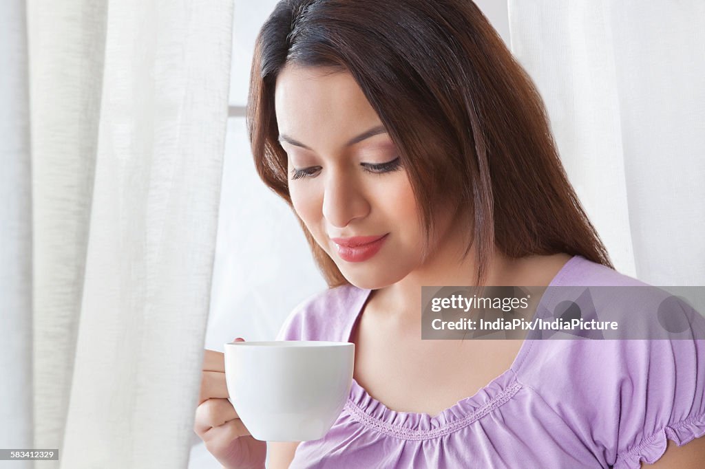 Young woman with a cup of coffee