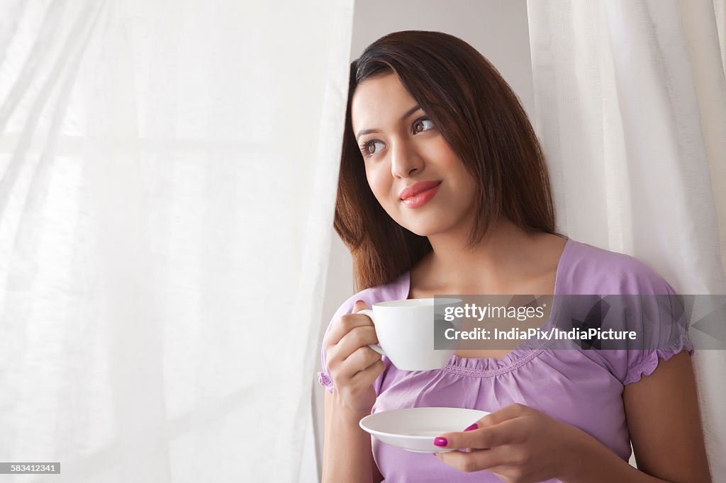 Young woman with a cup of coffee