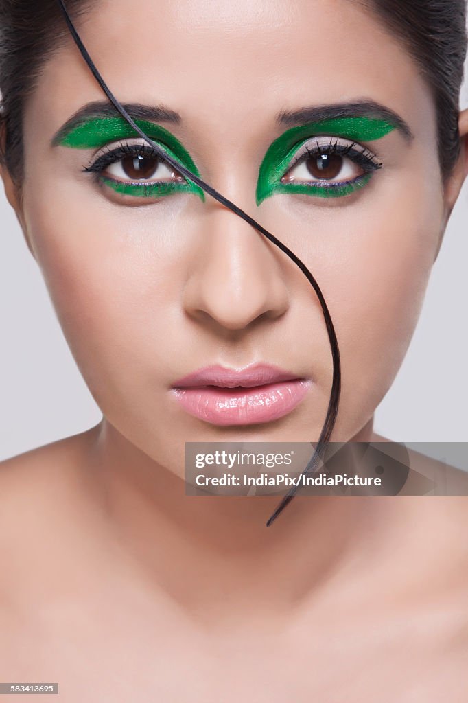 Portrait of young woman with make-up on face