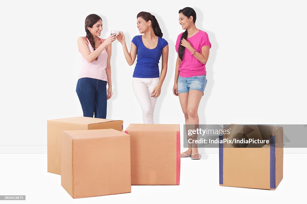 Young women with cartons