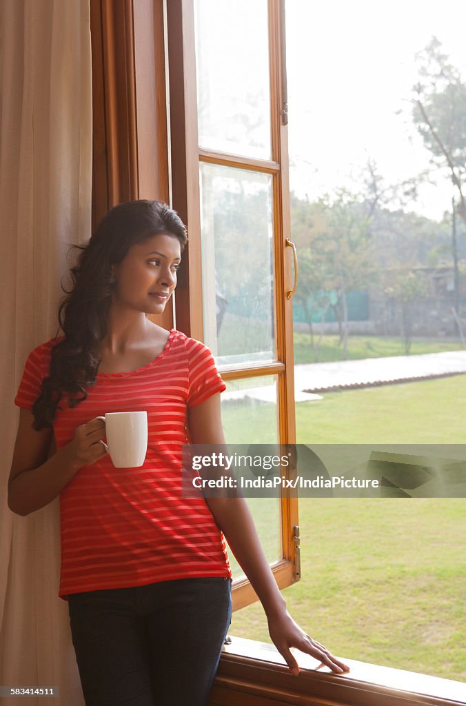 Woman looking out of window