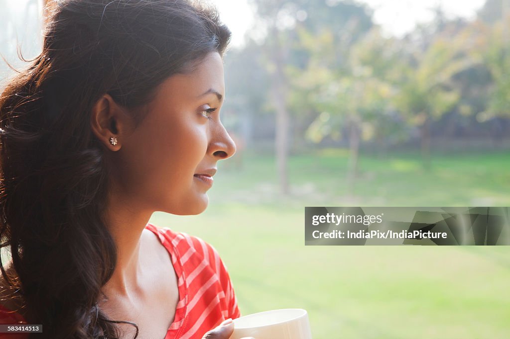 Woman looking out of window