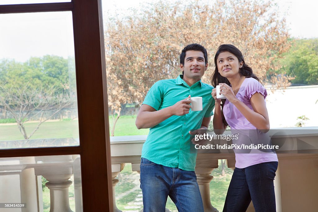 Couple admiring new house